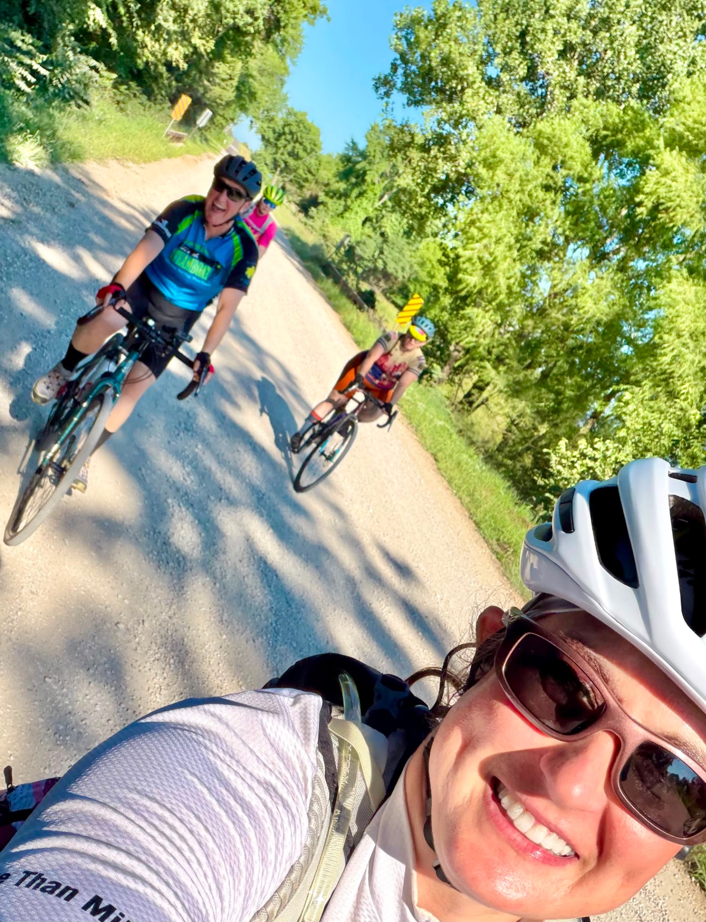 Amanda Duling and the More Than Miles cohort riding together on a gravel road