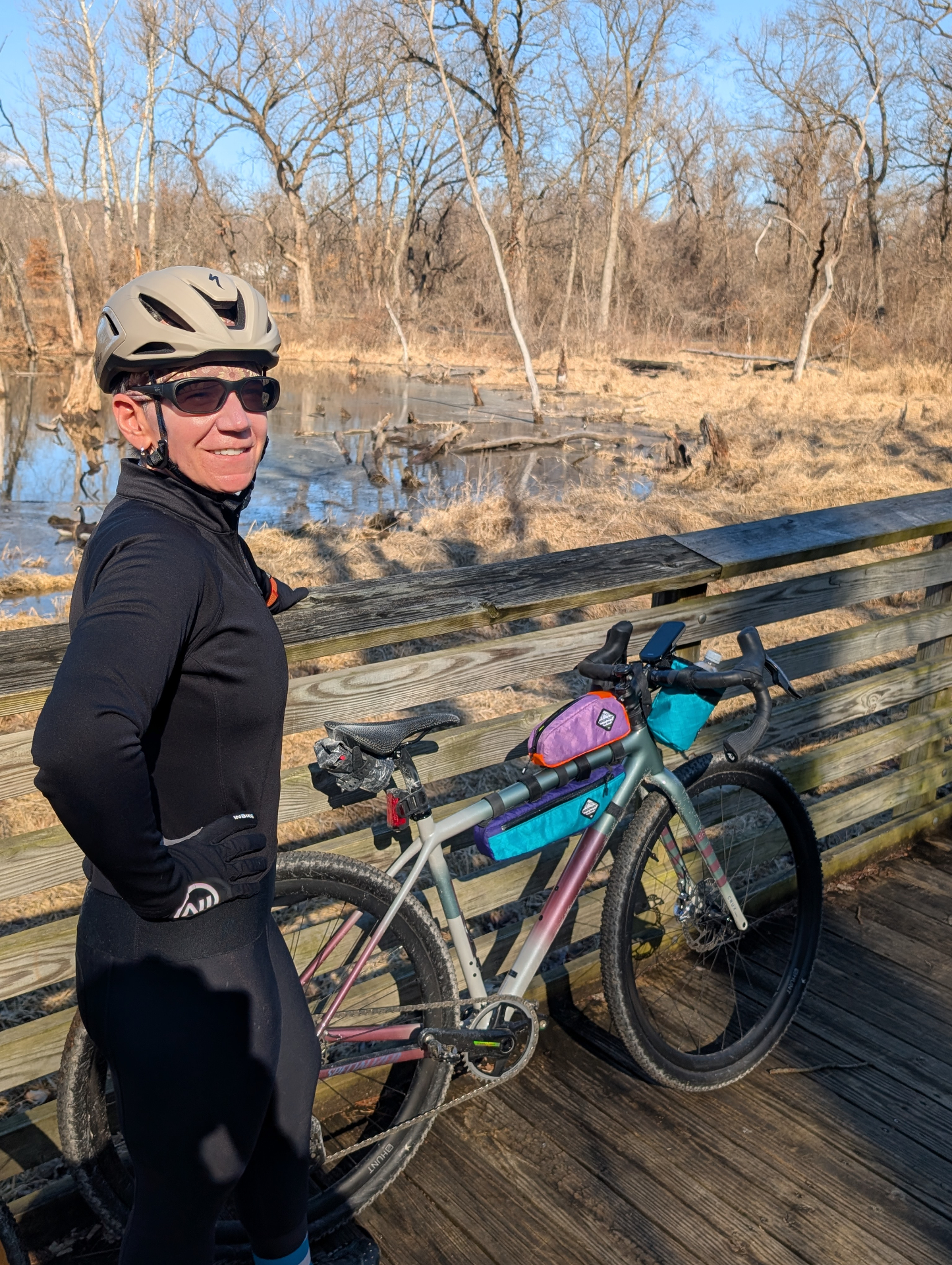 Women riding gravel bikes together at golden hour